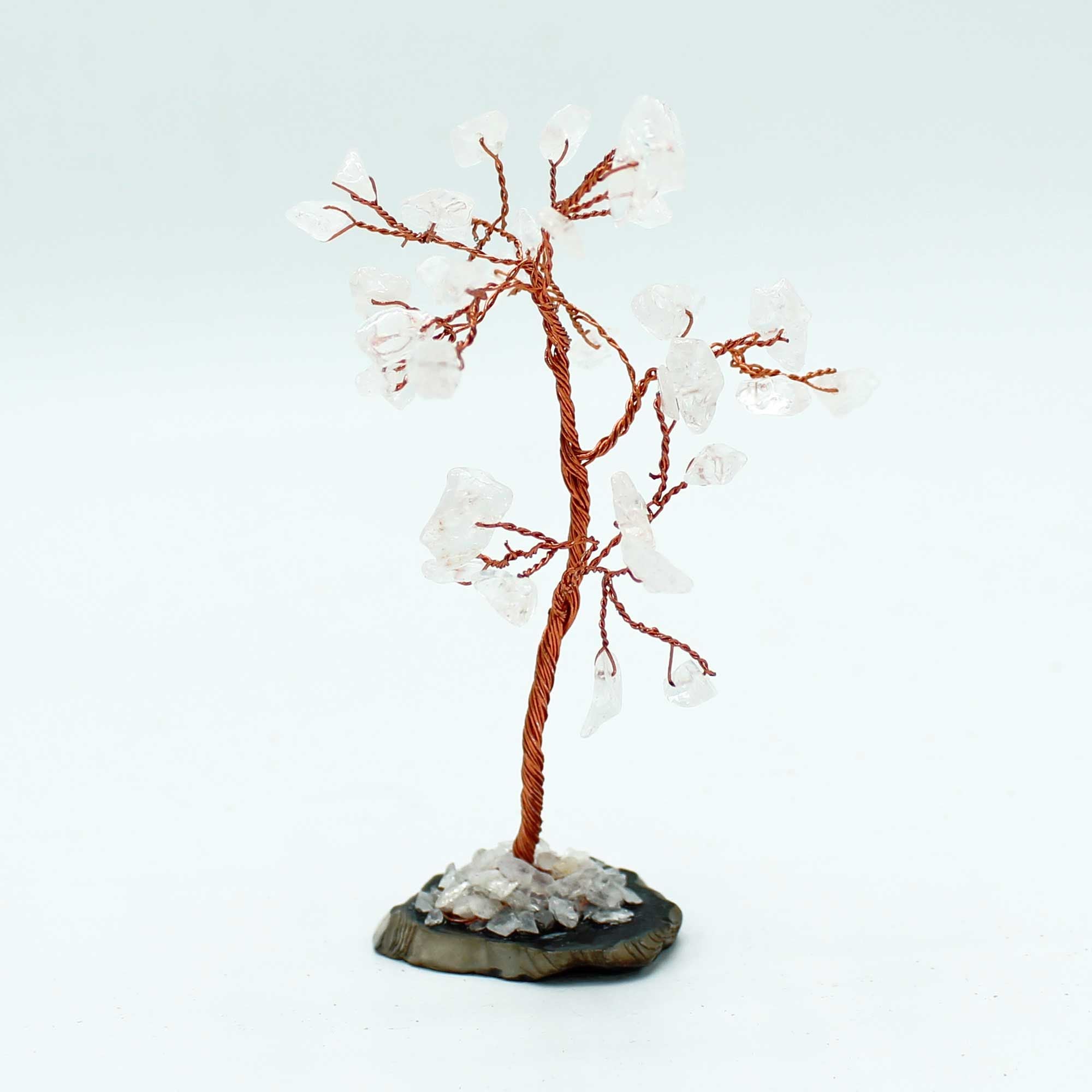 Árbol de cristal de cuarzo rosa sobre base de ágata negra