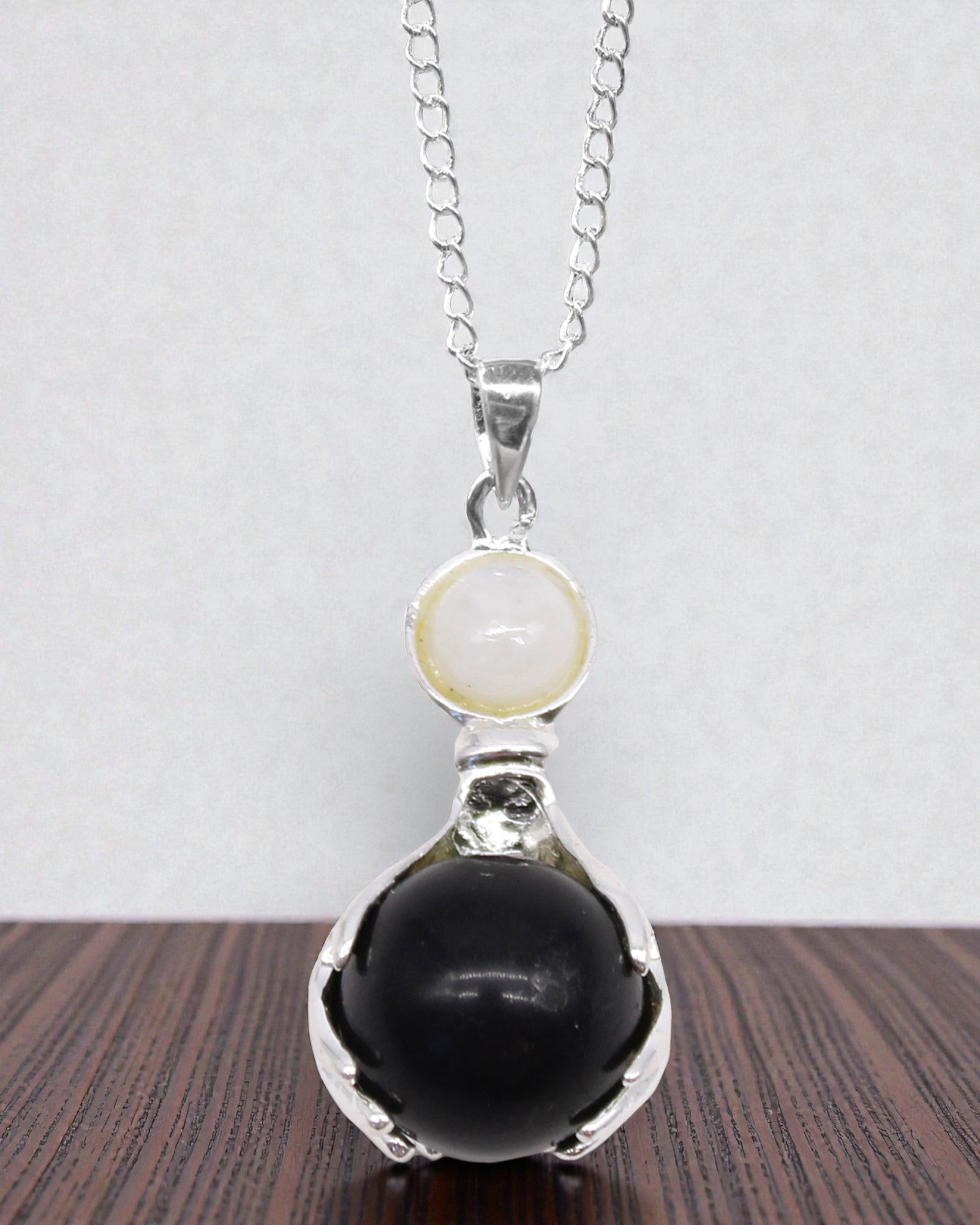 Crystal Hands – Pendant of Healing Hands made of Black Agate